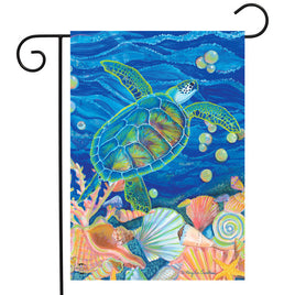 Sea turtle swimming around shells garden flag