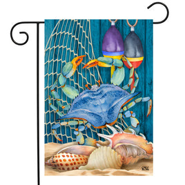 Blue Crab walking up the fish net with shells